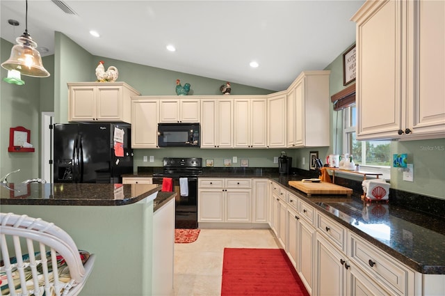 kitchen featuring visible vents, pendant lighting, vaulted ceiling, a kitchen breakfast bar, and black appliances