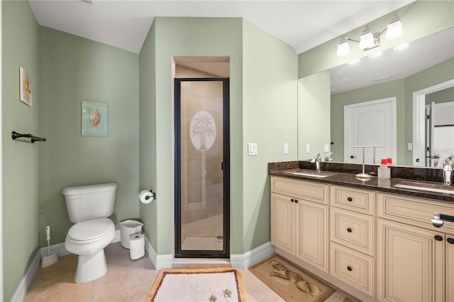 full bathroom with a sink, toilet, a stall shower, and tile patterned flooring