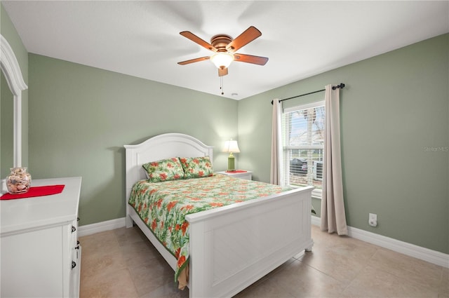 bedroom featuring light tile patterned flooring, baseboards, and ceiling fan