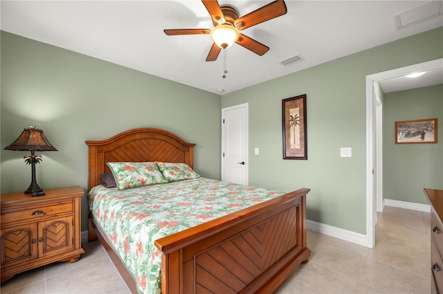 bedroom with light tile patterned floors, visible vents, baseboards, and a ceiling fan