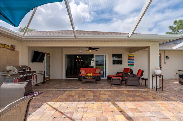 view of patio with ceiling fan, a lanai, grilling area, and an outdoor hangout area