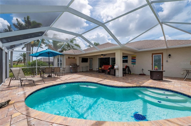 outdoor pool featuring grilling area, an outdoor kitchen, an outdoor hangout area, and a patio