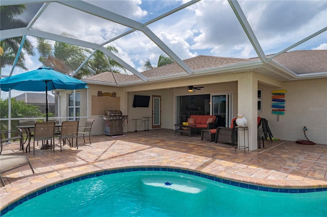 outdoor pool featuring a patio area, grilling area, an outdoor hangout area, and a lanai