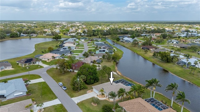 bird's eye view with a residential view and a water view