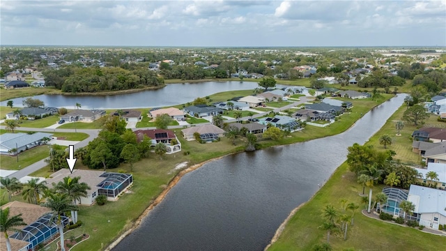 birds eye view of property with a residential view and a water view