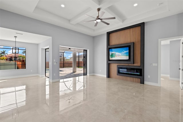 unfurnished living room featuring a high ceiling, coffered ceiling, a fireplace, and baseboards