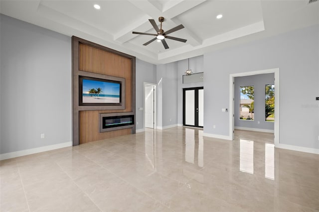 unfurnished living room with beam ceiling, recessed lighting, a large fireplace, coffered ceiling, and baseboards