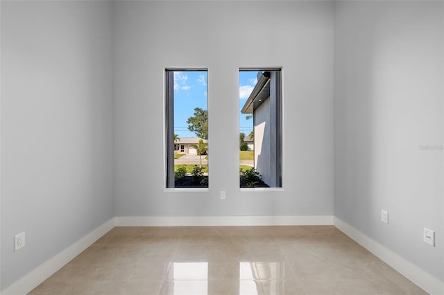 empty room featuring baseboards