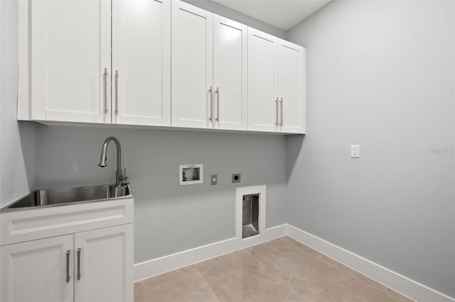 laundry room with hookup for a washing machine, hookup for an electric dryer, a sink, baseboards, and cabinet space