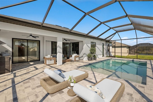 pool featuring a patio area, a lanai, an outdoor living space, and a ceiling fan