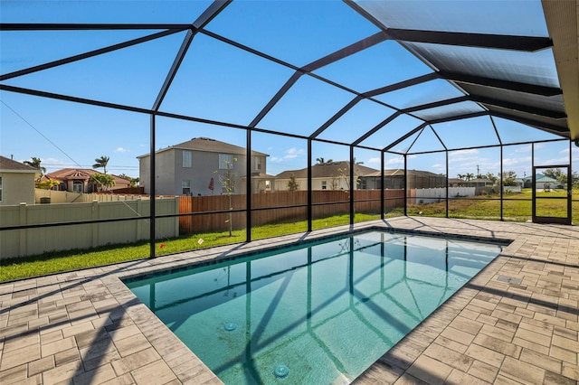 view of swimming pool featuring a patio area, fence private yard, and a residential view