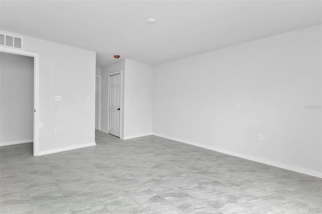 unfurnished bedroom with visible vents, baseboards, and a closet