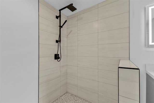 full bath featuring a tile shower