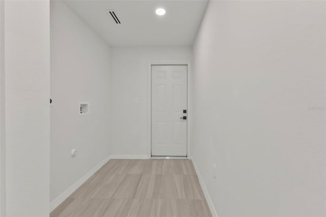 spare room featuring visible vents and baseboards