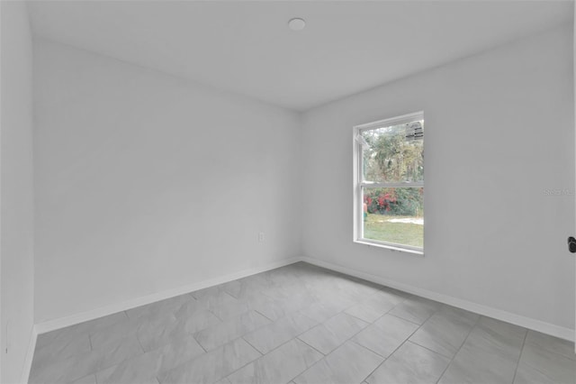 empty room with baseboards