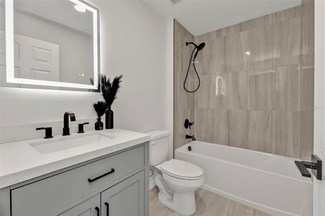 full bath featuring shower / bathing tub combination, toilet, and vanity