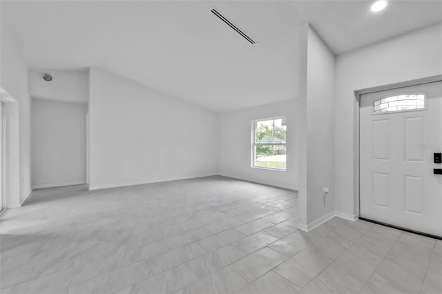 entrance foyer with baseboards and visible vents