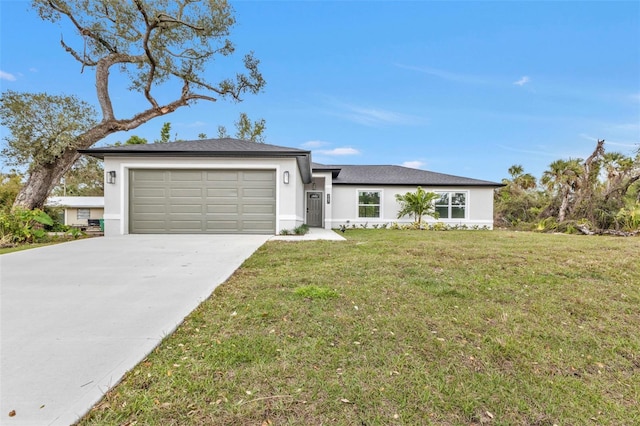 view of front of property with a front yard, concrete driveway, a garage, and stucco siding