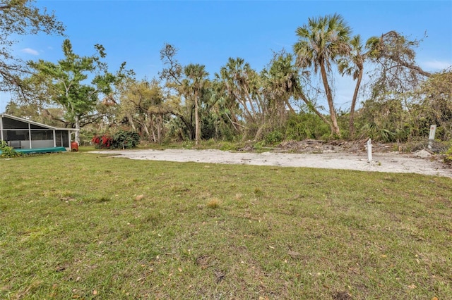 view of yard with a sunroom