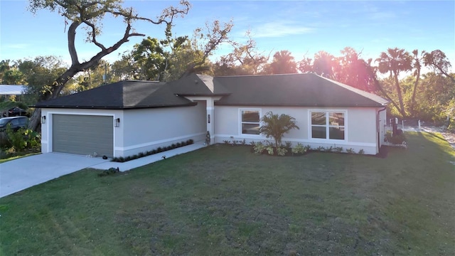 ranch-style home featuring a front lawn, an attached garage, driveway, and stucco siding