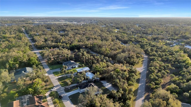 aerial view featuring a wooded view