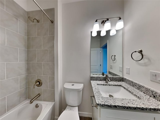 full bathroom with baseboards, shower / bathing tub combination, vanity, and toilet