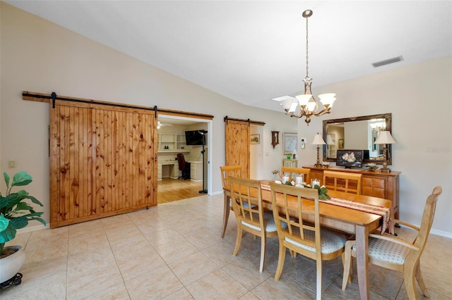 dining space featuring visible vents, a barn door, an inviting chandelier, light tile patterned floors, and lofted ceiling