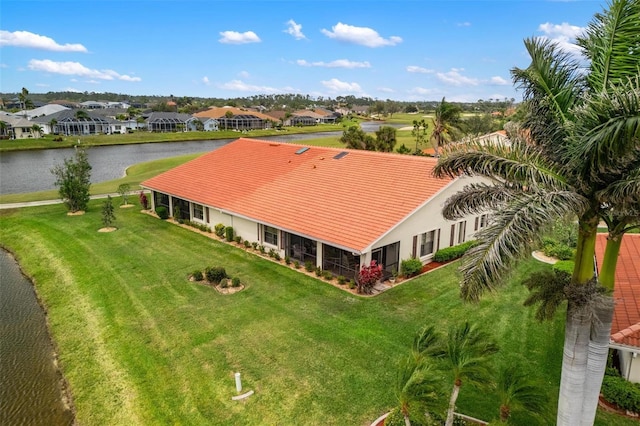 bird's eye view featuring a water view and a residential view