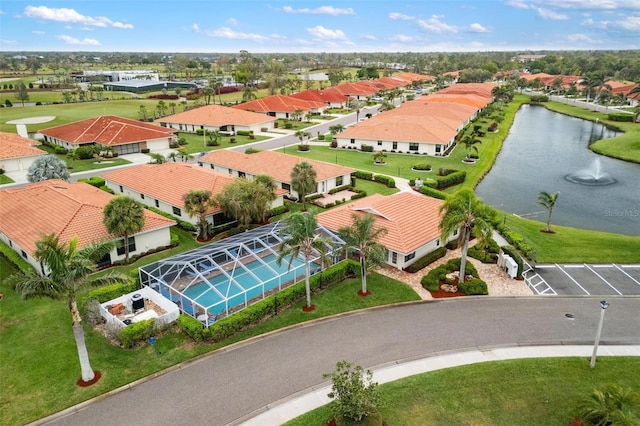 aerial view featuring a residential view and a water view