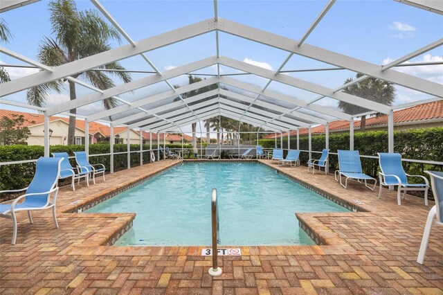 community pool with a patio area and a lanai