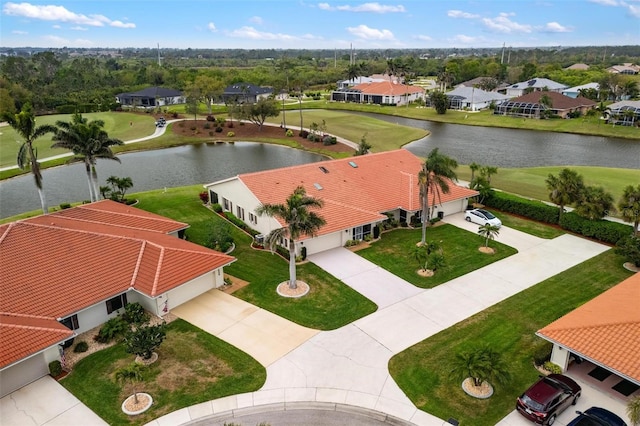 aerial view with a residential view and a water view