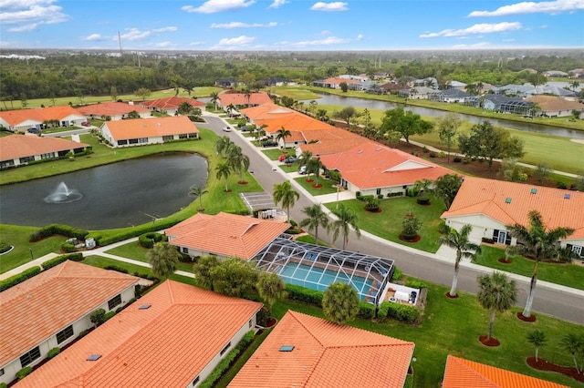 bird's eye view with a residential view and a water view