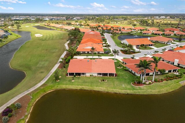 aerial view featuring a residential view, a water view, and golf course view