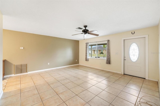 foyer with visible vents, ceiling fan, baseboards, and light tile patterned floors