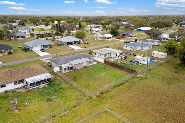 birds eye view of property with a residential view