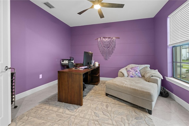 tiled office with baseboards, visible vents, and a ceiling fan