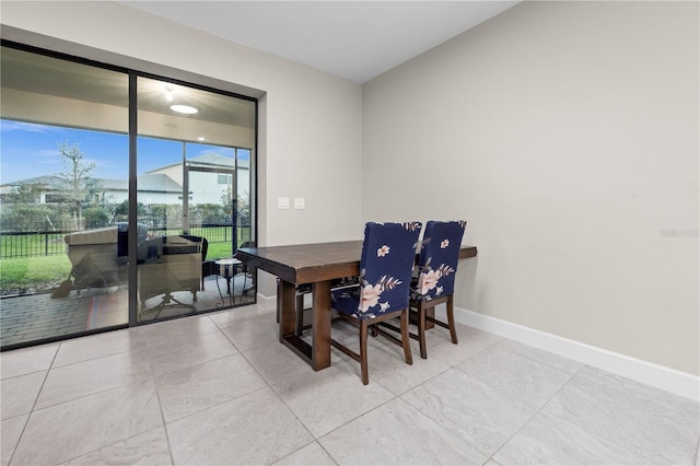 dining room featuring baseboards