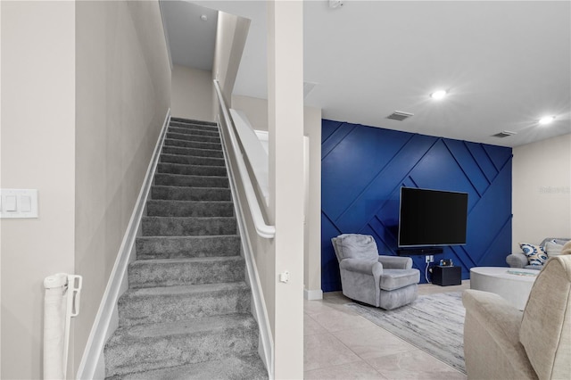 stairs featuring baseboards, visible vents, and recessed lighting