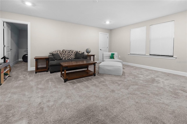 living area with carpet, baseboards, and recessed lighting