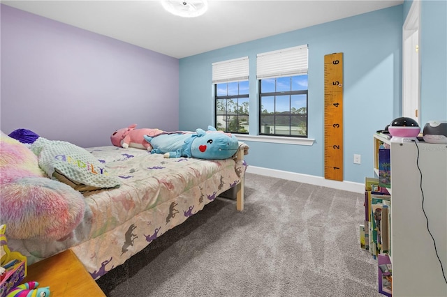 bedroom with carpet and baseboards