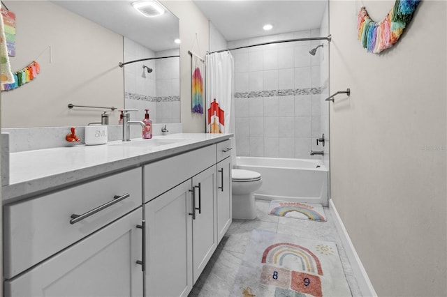 bathroom with baseboards, vanity, toilet, and shower / bath combo with shower curtain