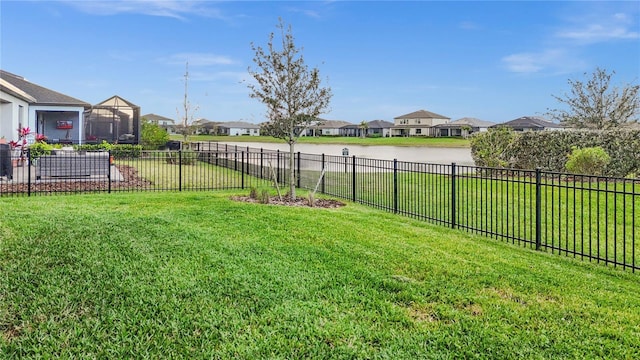 view of yard featuring a residential view and fence