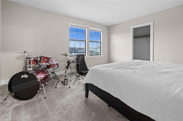 carpeted bedroom with baseboards