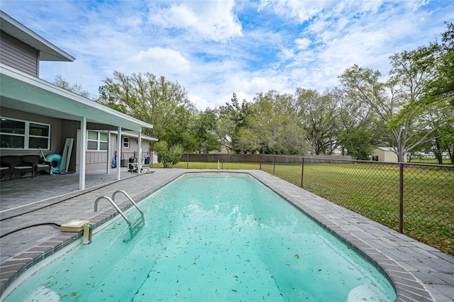 view of swimming pool with a yard, a patio, a fenced backyard, and a fenced in pool