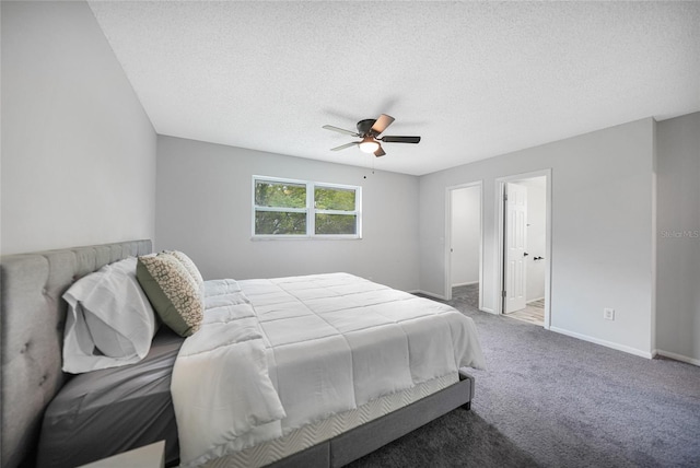 carpeted bedroom featuring ceiling fan, a textured ceiling, and baseboards