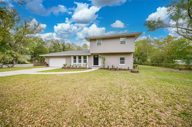 view of front of house featuring stucco siding, an attached garage, fence, driveway, and a front lawn