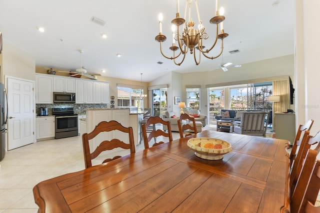 dining space with recessed lighting, light tile patterned floors, ceiling fan with notable chandelier, and visible vents