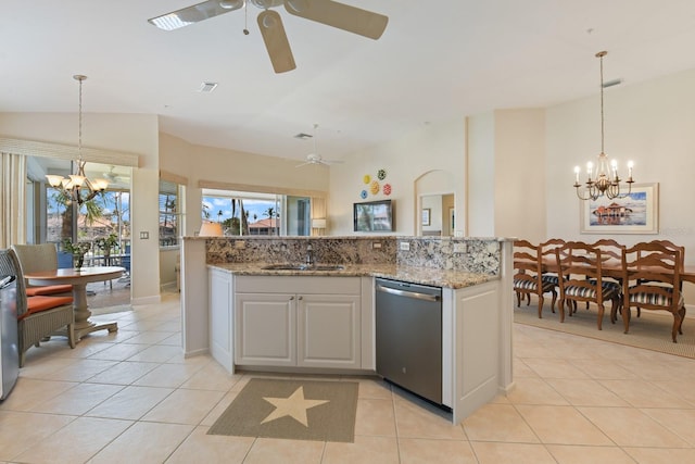 kitchen with a sink, stainless steel dishwasher, pendant lighting, and light tile patterned floors