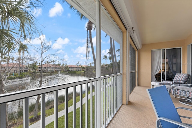 balcony featuring a water view