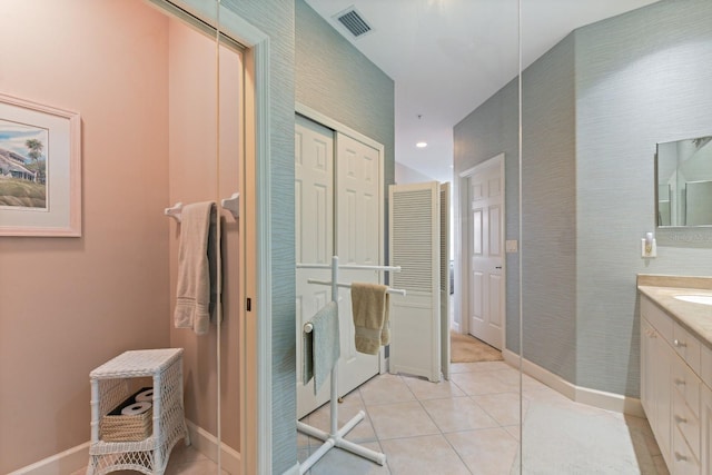 full bathroom with tile patterned flooring, vanity, visible vents, and baseboards